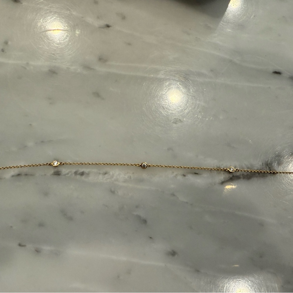 Tiffany Peretti Diamonds by the yard 18k yellow gold three diamond bracelet